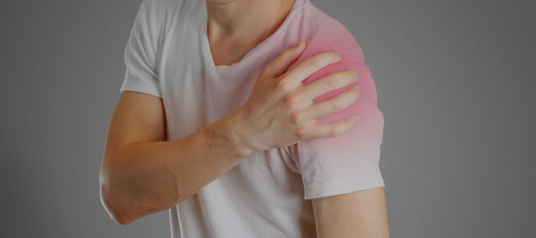 man holding his shoulder in pain