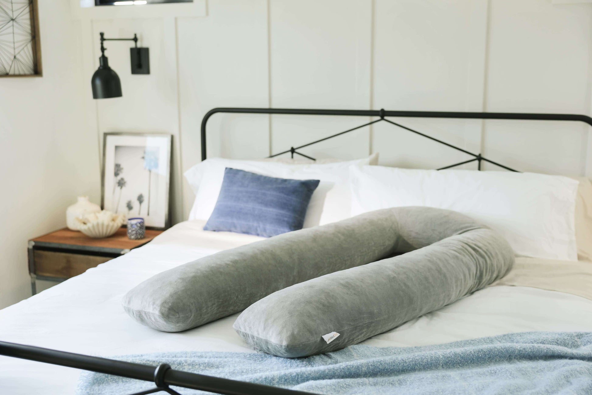 Pregnancy Body Pillow on a bed in a bedroom setting