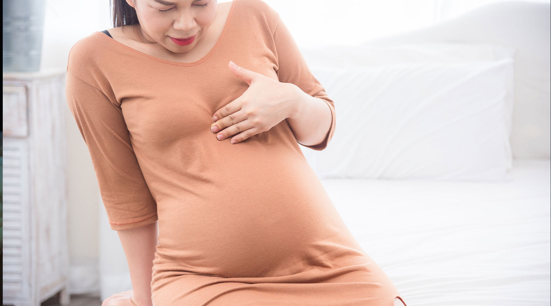 Pregnant woman suffering from acid reflux