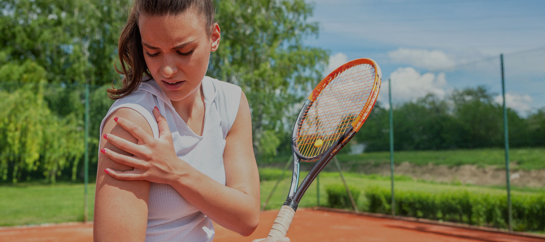woman playing tennis with shoulder pain 