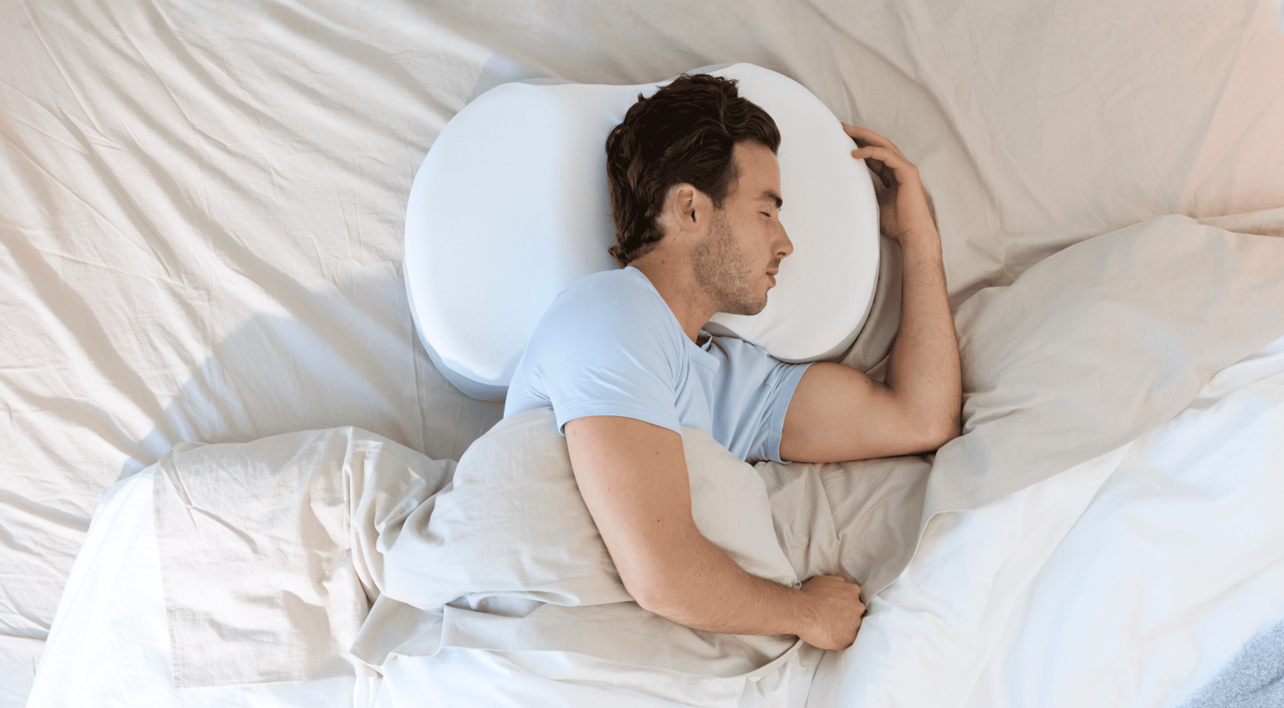 Man sleeping with the Multi-Position Neck Pillow 